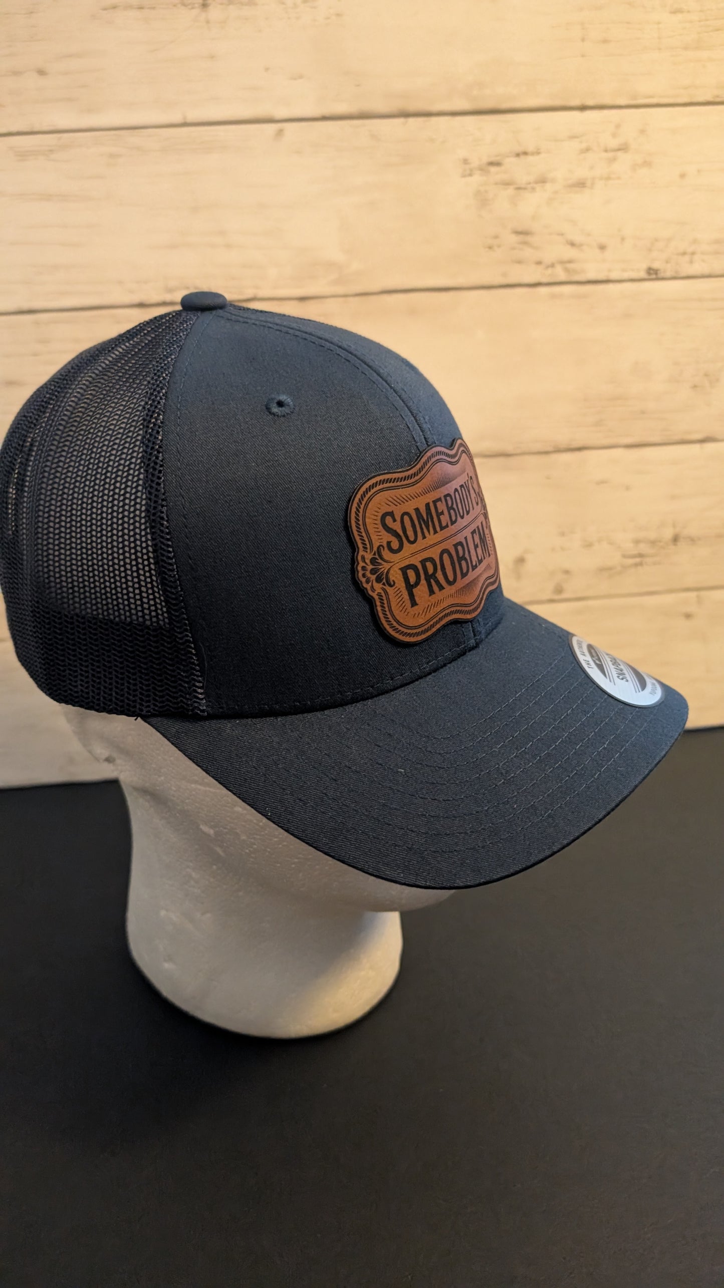 "Somebody’s Problem" Leatherette Patch Hat | Navy Blue Yupoong Snapback